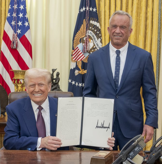 President Trump sits next to RFK Jr after his confirmation to Secretary of the Department of Health in 2025.